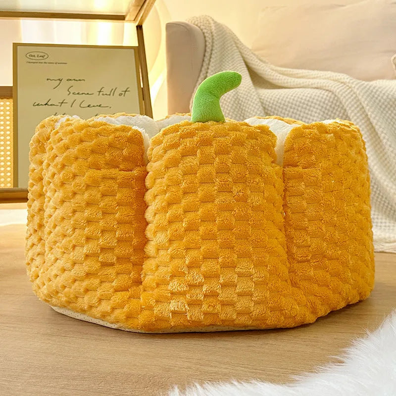 Pumpkin-shaped pet nest with raised sides and cotton filling for cats and small dogs