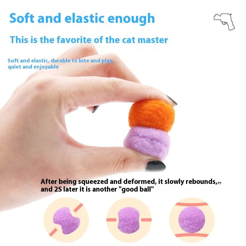 Pet toy launch gun with a selection of soft red plush balls for interactive dog and cat fetch games.