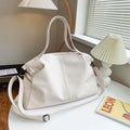 Large soft surface PU tote messenger bag in horizontal square shape with shoulder strap and zipper opening