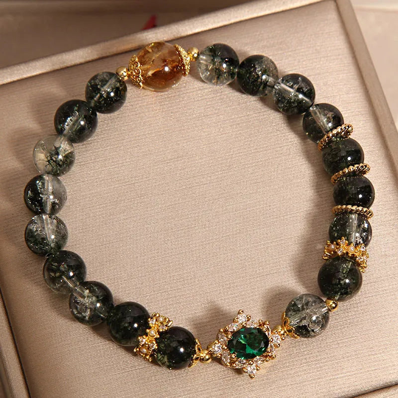 Gold rutilated quartz bracelet with green phantom quartz beads, gold ruby quartz accents, pearl and rhinestone details