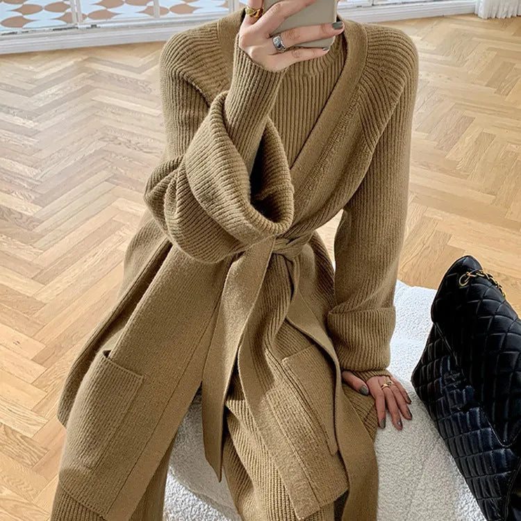 Women's apricot knitted three-piece set featuring a cardigan, sweater, and wide-leg trousers on a hanger.