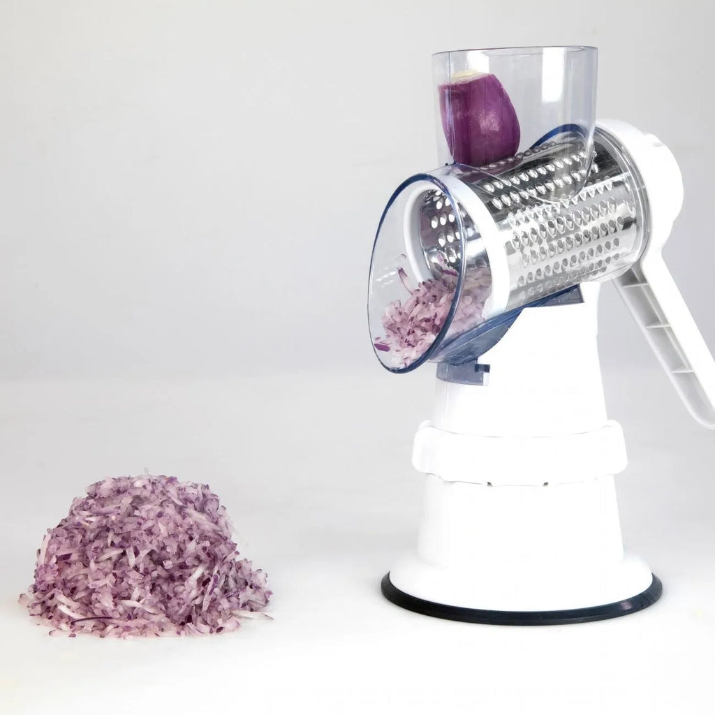 White manual vegetable slicer, grater, and chopper with three stainless steel blades and suction feet.