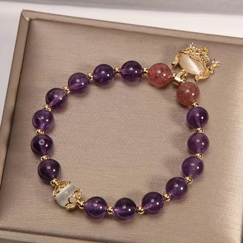 Handmade women's copper bracelet with natural amethyst stone and real gold longevity lock centrepiece
