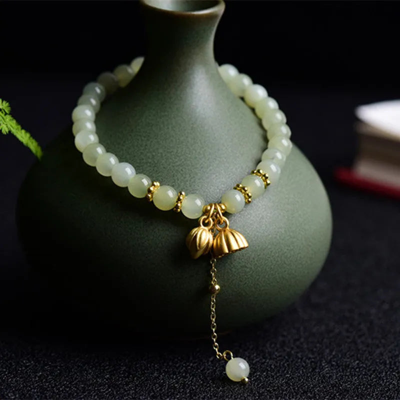 Shihuan natural Hetian jade bracelet with 6mm beads and a central fu character.