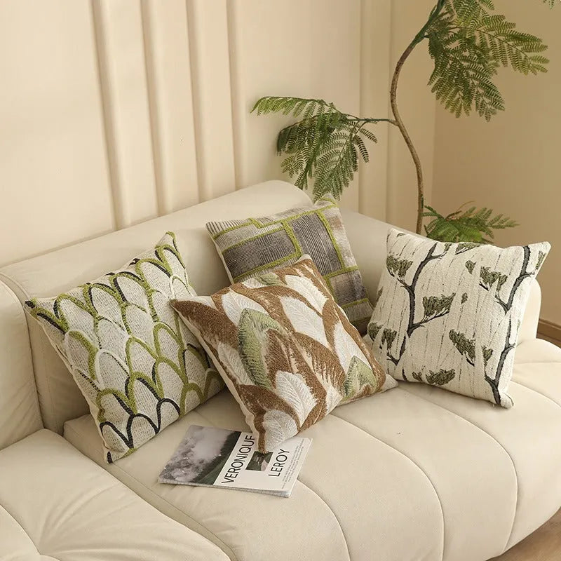 Close-up of a 45cm square jacquard cushion cover with a woven floral pattern in retro Nordic style.