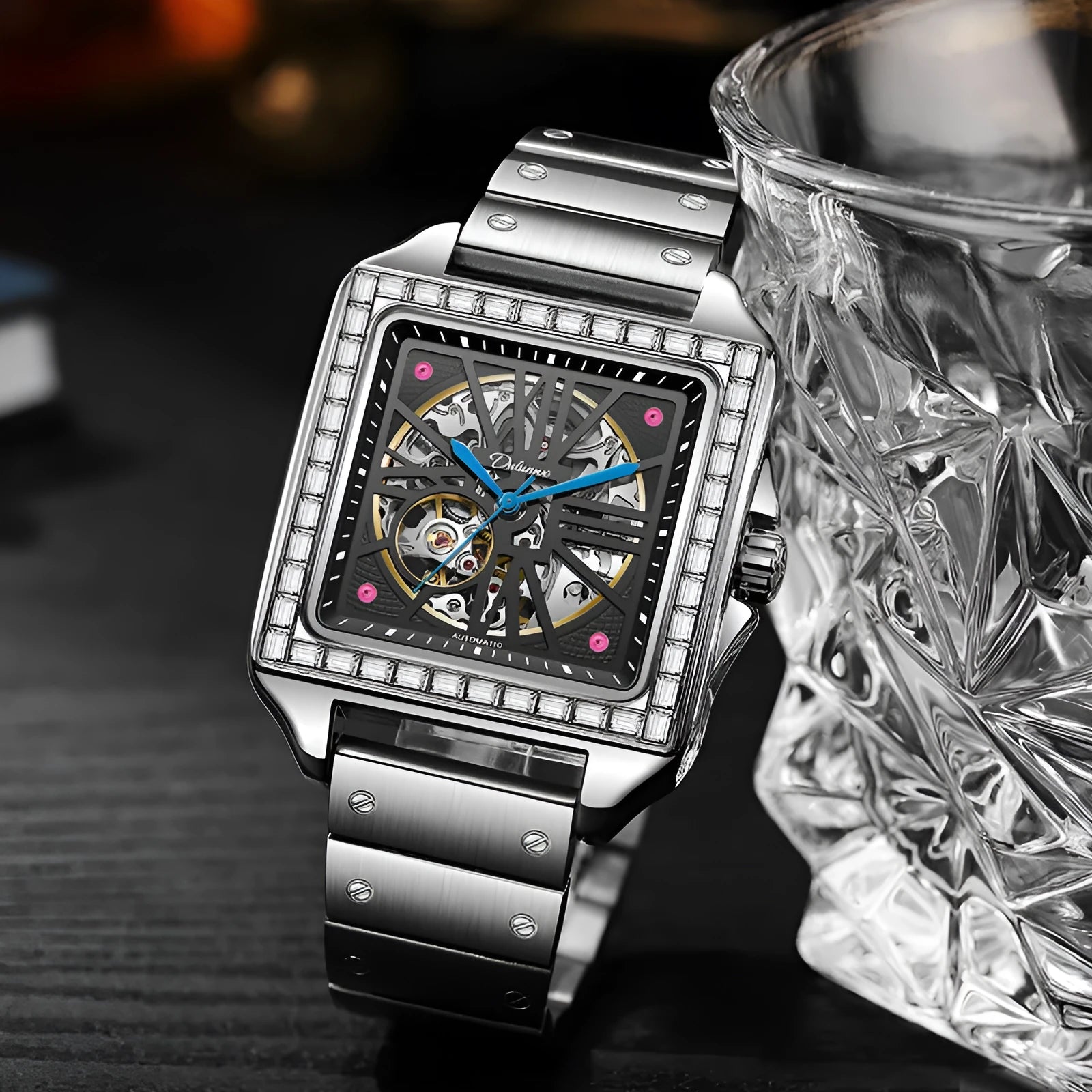 Men's square-faced automatic watch with diamond-studded case on a choice of strap.