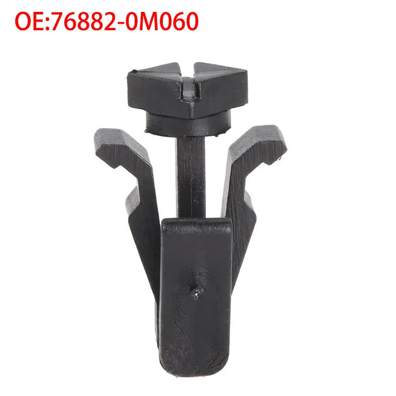 Black plastic Nissan bumper cover radiator grille fastening clip, part number 76882-0M060.