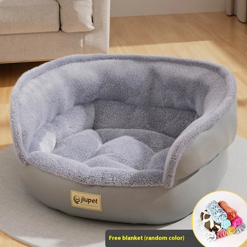 Green cloth sofa-style dog kennel with matching blanket, size M, on a wooden floor