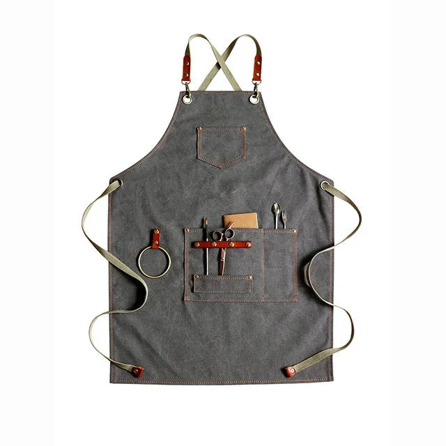 Canvas apron with cross-strap design in camel colour for café work and baking