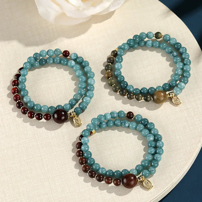 Women's blue gold sandalwood beaded bracelet with geometric design and Fu character, New Chinese style.