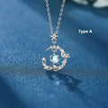 Geometric alloy pendant necklace showing a tree and bird silhouette on an adjustable chain.