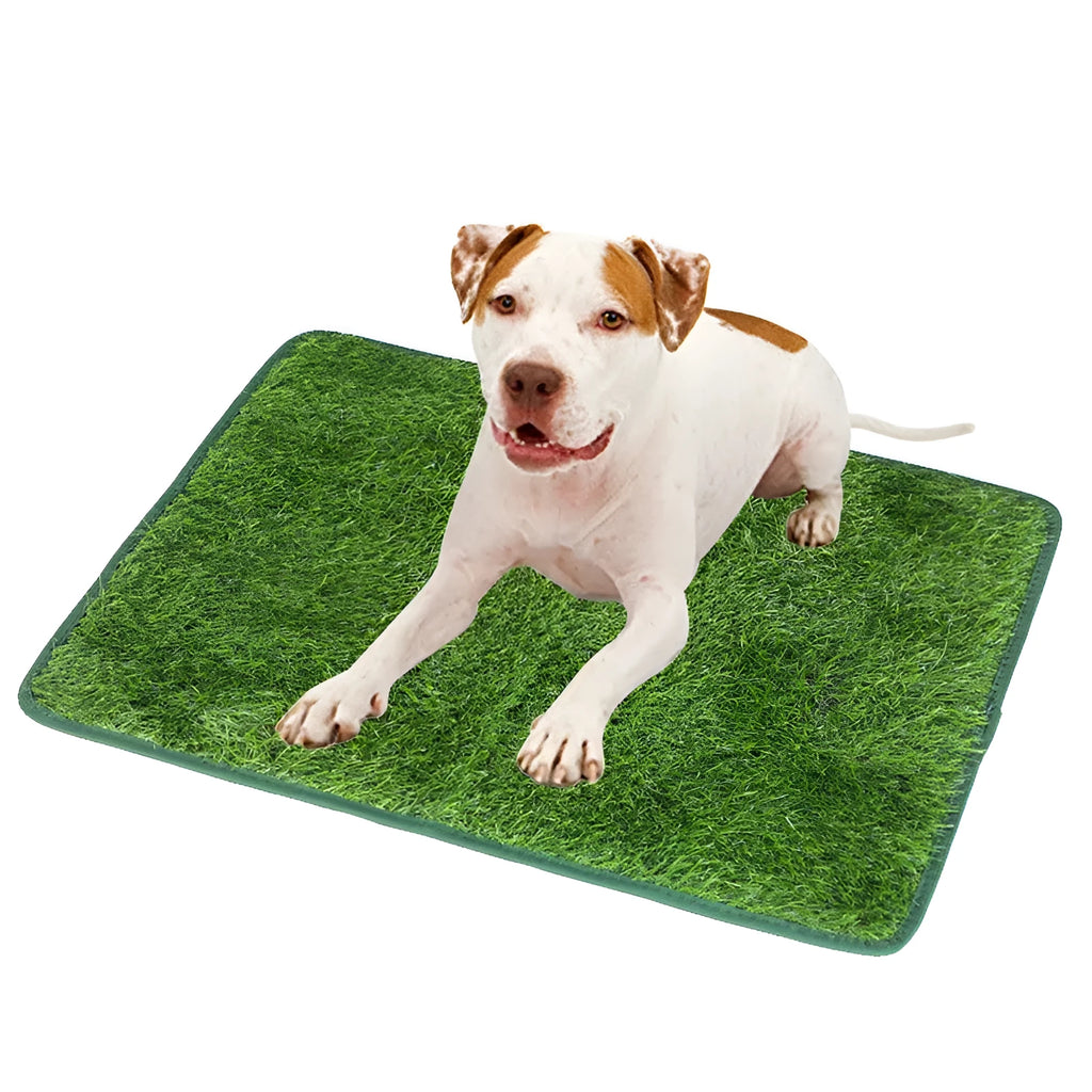 Green washable dog grass pee mat with realistic lawn texture on a patio.