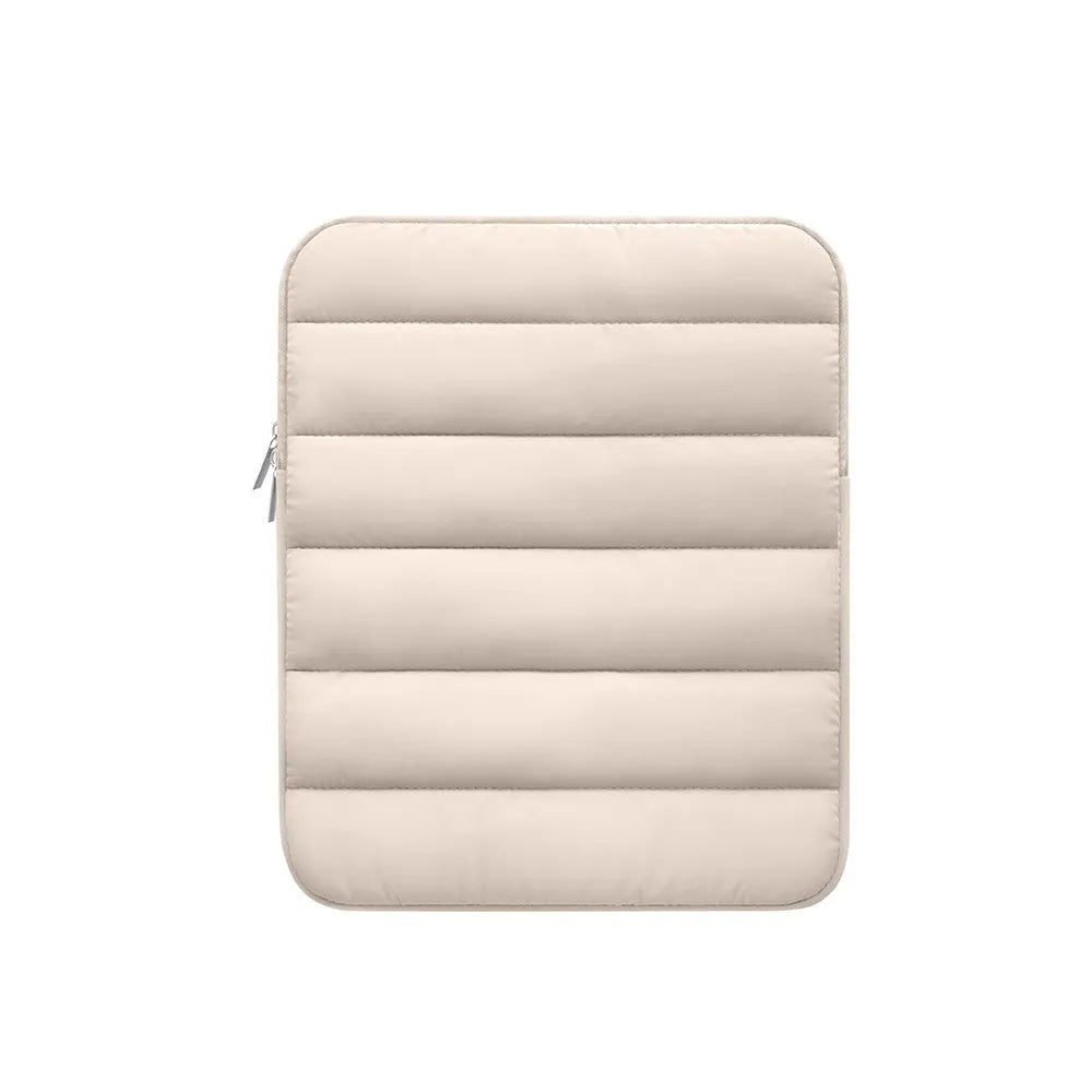 Fluffy black laptop sleeve puff bag with elastic closure for a 9.7 to 11 inch device.