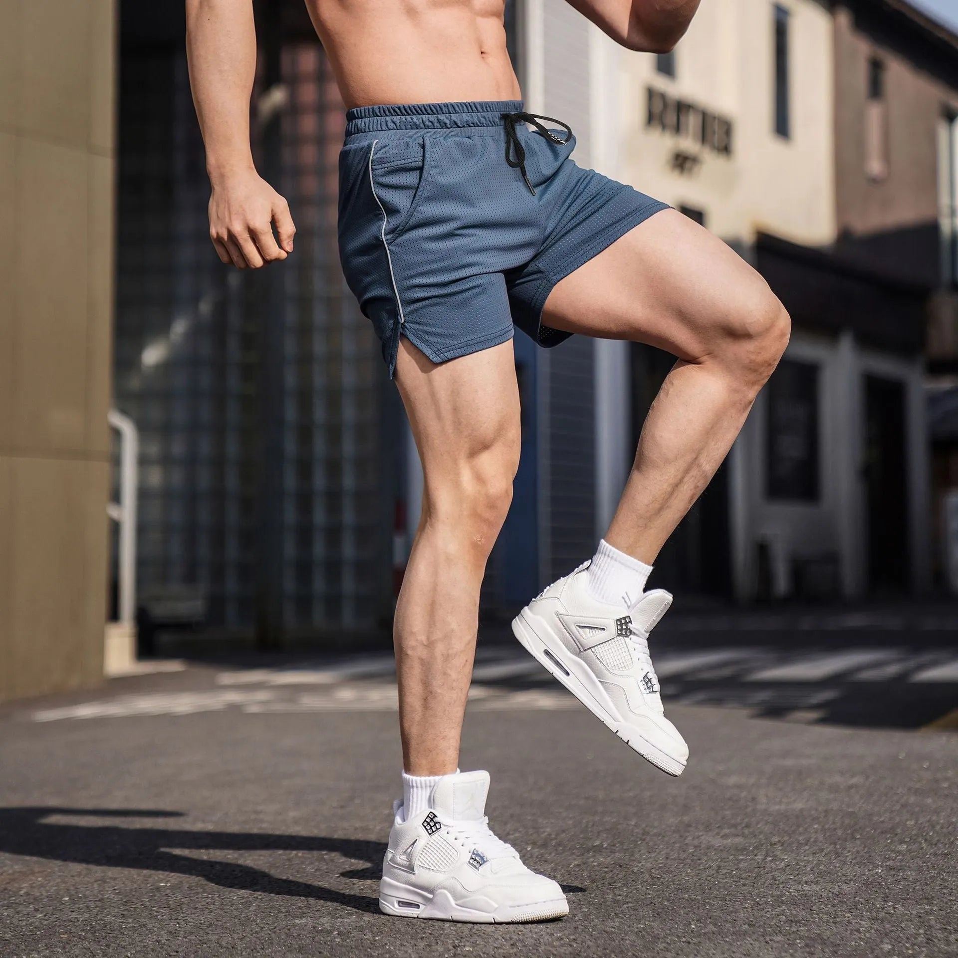 Men's black polyester casual sports shorts with a straight cut, shown laid flat.
