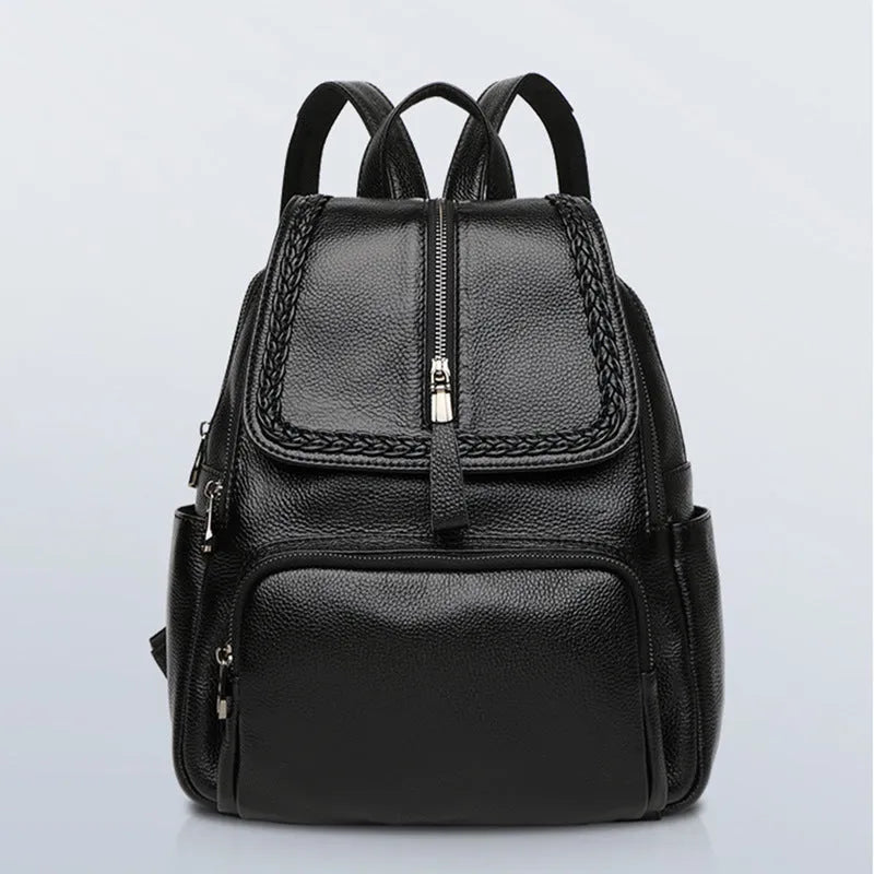 Solid colour genuine leather women's backpack showing blue and wine red options with internal compartments.