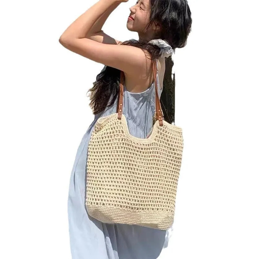 Beige woven cotton linen shoulder bag showing textured material and magnetic snap closure