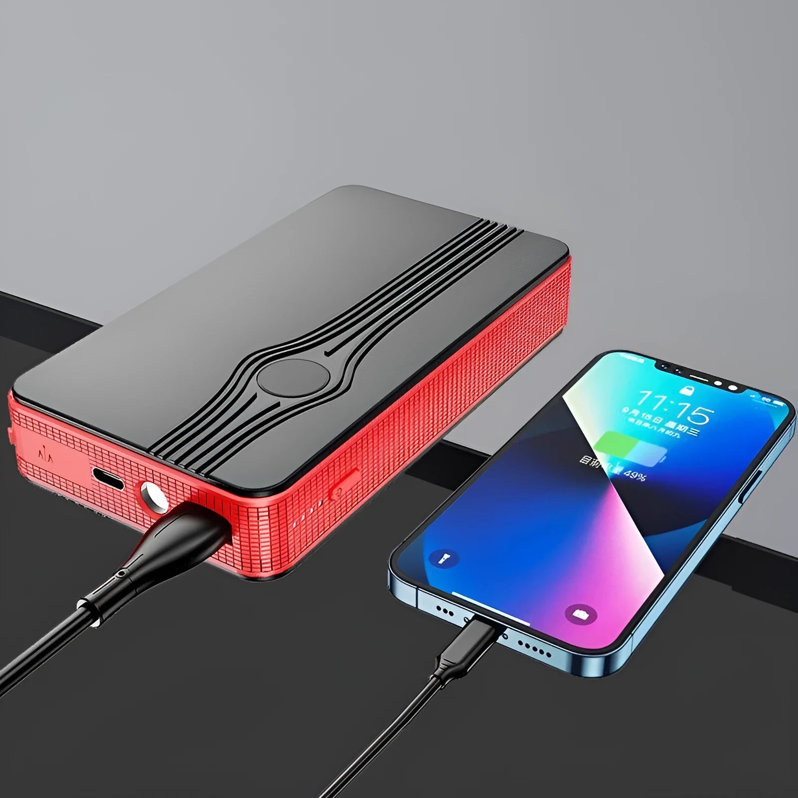Red K4-E portable car jump starter and power bank unit with USB port and display.