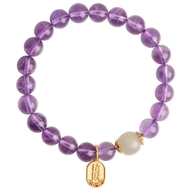 Close-up of a women's bracelet with purple amethyst crystal geometric beads measuring 8mm