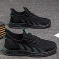 Low-top mesh sneaker with plastic sole in black colour showing striped pattern and flat heel design