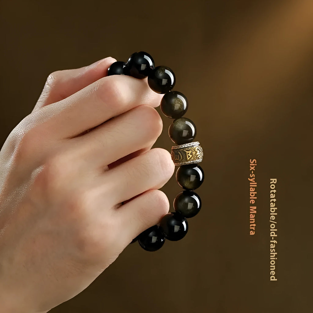 Natural cinnabar bead bracelet with a carved gold or silver animal charm in a gift box.