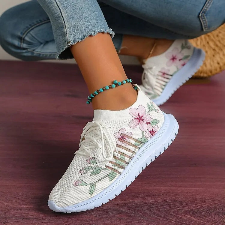 Milky white women's casual running shoes with mesh flyknit upper and rubber sole.