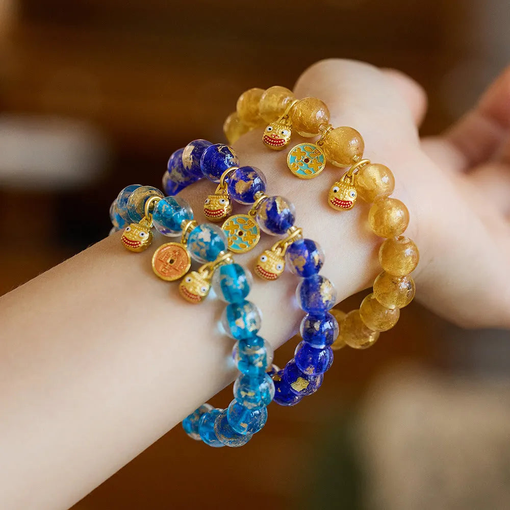 Handmade national style glass coloured glaze swallowing gold beast bracelet in fragrant grey with gold foil accents