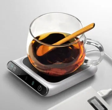 Black USB coffee heater with tempered glass surface showing three temperature settings and drinking water reminder
