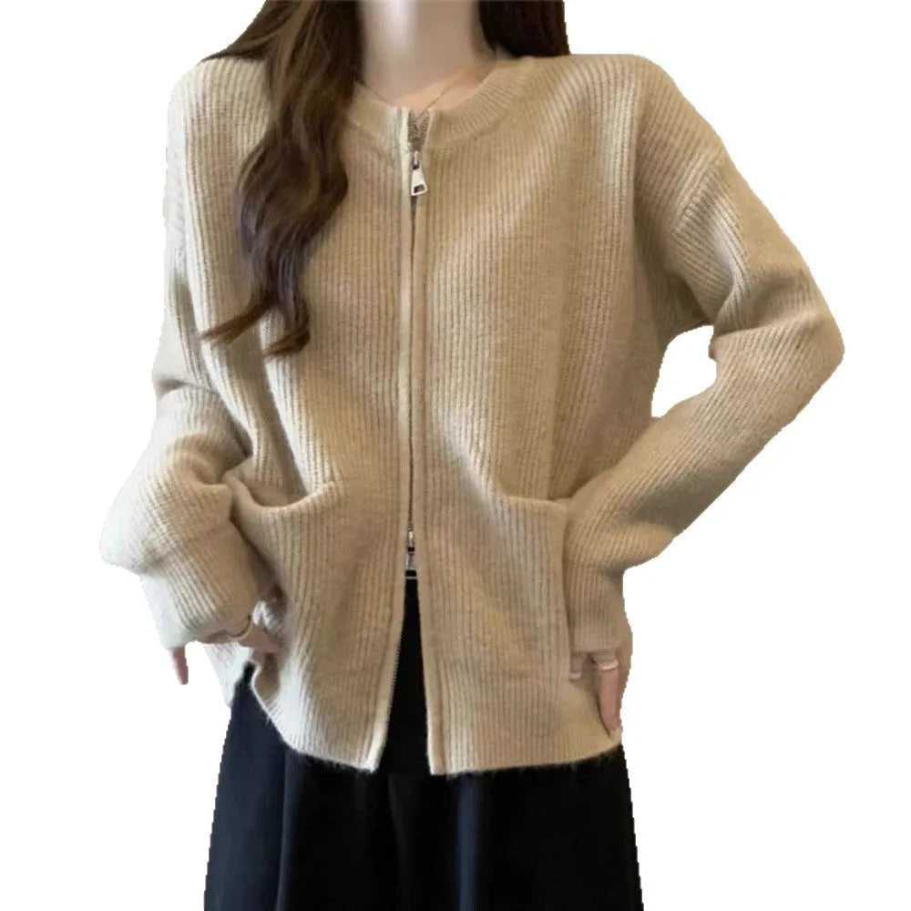 Beige viscose sweater coat cardigan with long sleeves on a hanger.