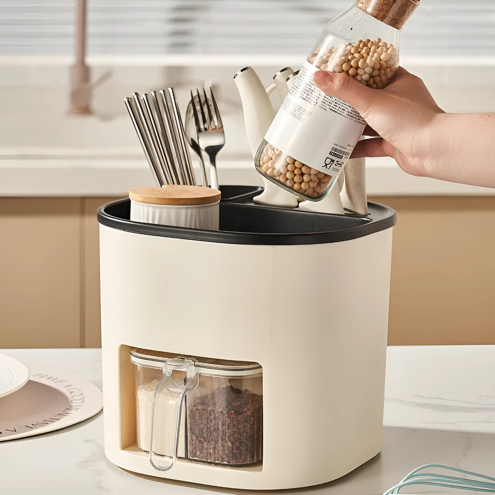 White rotating kitchen storage bucket and four-compartment spice box organiser for cutlery and seasonings.