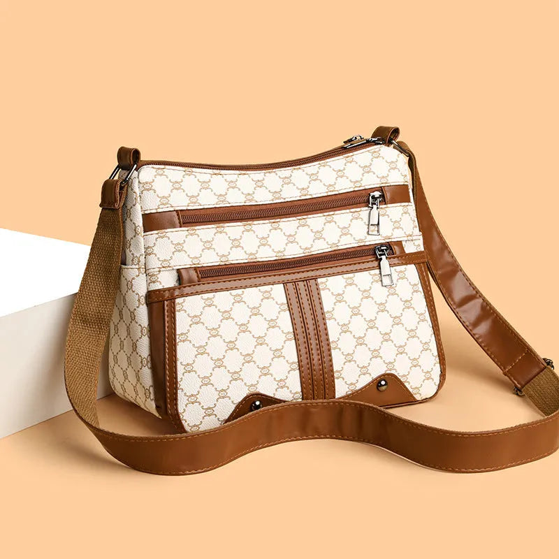 Brown stitching pattern women's crossbody bag made from PU leather with an adjustable strap.