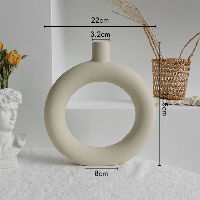 Unglazed matte ceramic dry flower vase with textured surface in Nordic style