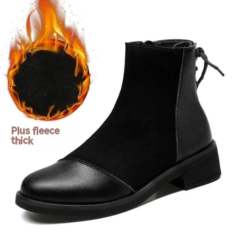 Black women's knee-high Martin boots with side zip, round toe, and block heel on a rubber sole.