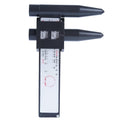 Plastic electronic digital caliper hole distance measuring tool with digital display on a work surface.