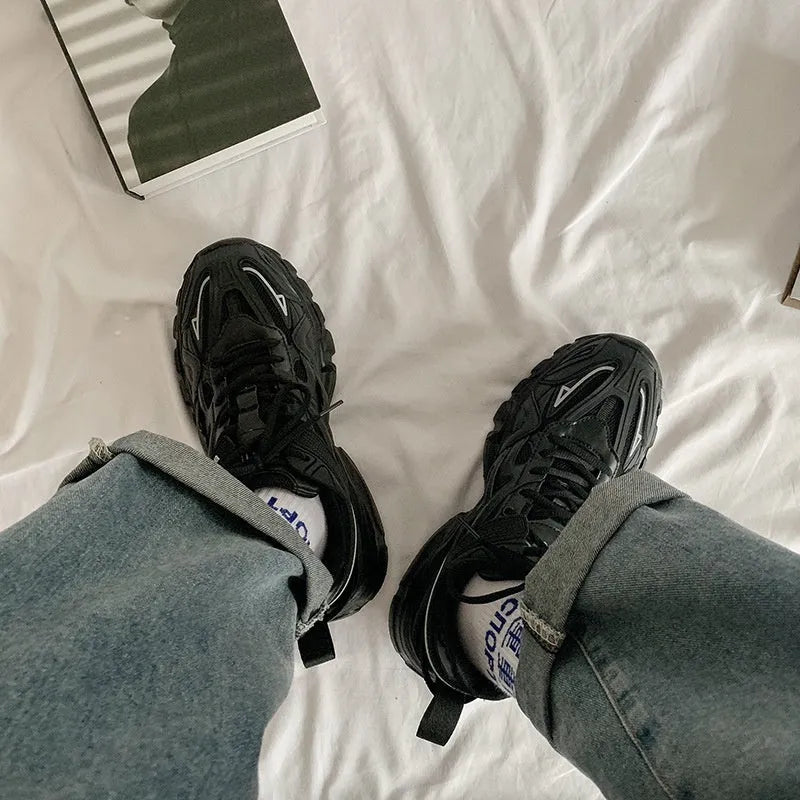 Casual breathable sports shoes with a lace-up front, round toe, and rubber sole in a solid colour.