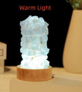 Natural amethyst crystal night light with USB plug showing both warm and cold light settings