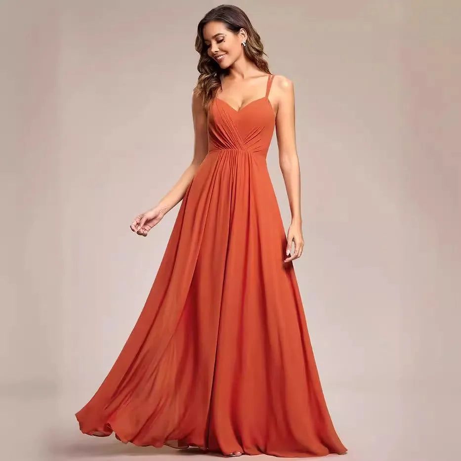 Sleeveless long pleated A-line women's dress in light green polyester fabric, shown on a model.