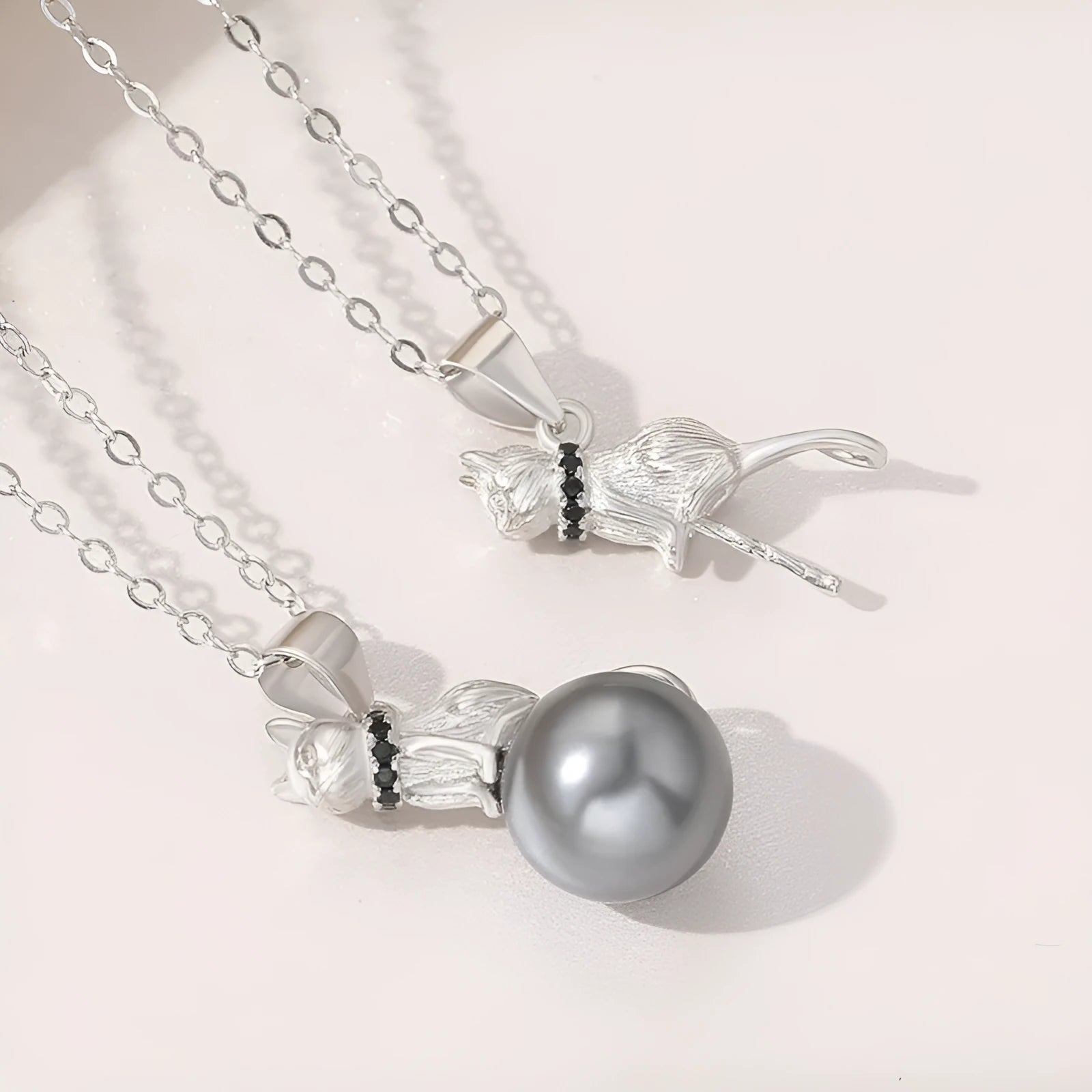 925 sterling silver cat pendant necklace on a clavicle-length chain, showing the detailed feline charm.