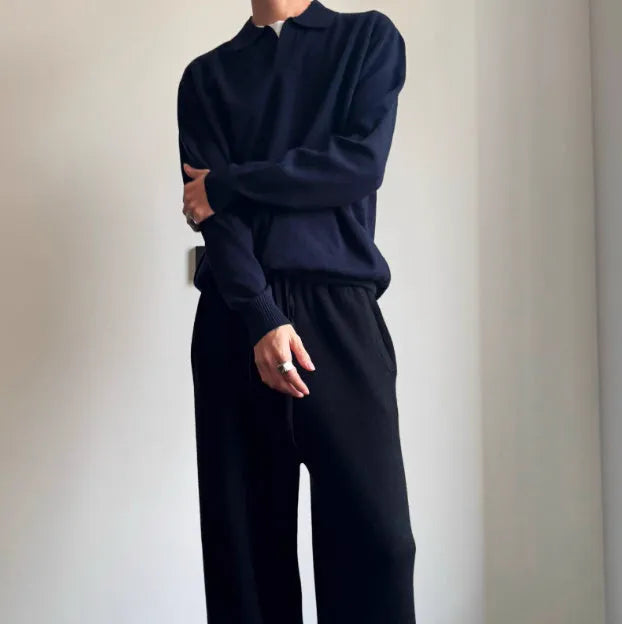 Man wearing a milky white pure wool polo collar sweater with a lapel design.
