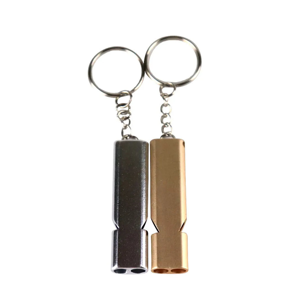 Silver or gold coloured aluminium alloy double hole outdoor survival whistle.