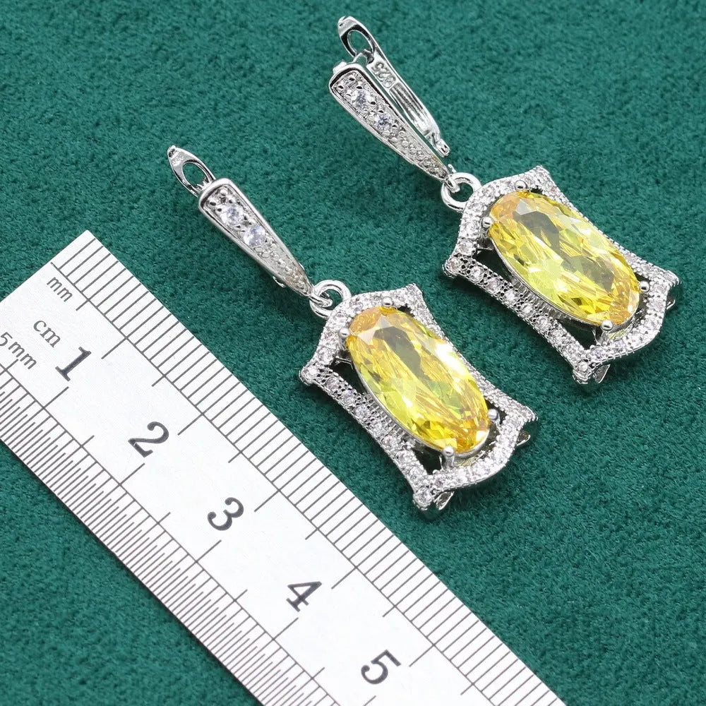 Women's anti-allergy zircon jewellery set in yellow with necklace, earrings, ring, and bracelet on display.