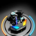 Black Bluetooth in-ear gaming headset with a simple stylish design on a plain background.