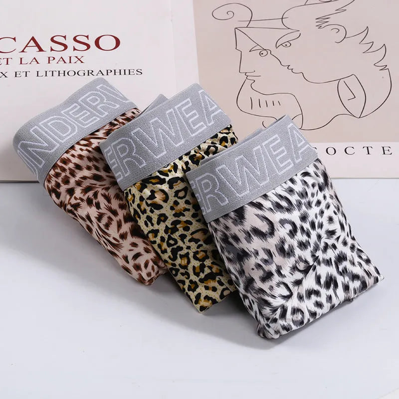 Men's loose leopard print underwear in milk silk polyester fabric showing mid-waist design