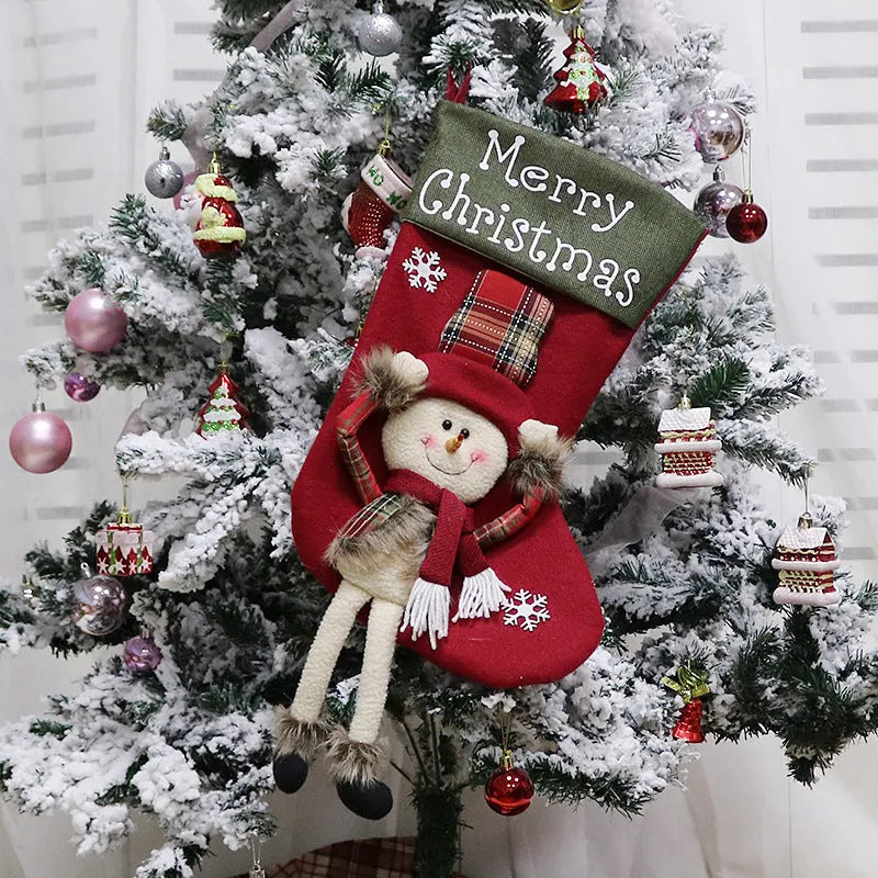 Three large Christmas stockings featuring Santa, Snowman and Reindeer designs with 3D applique decorations