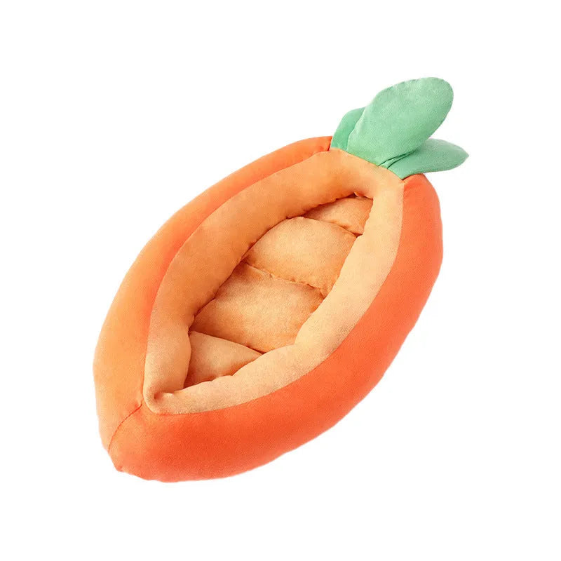 Carrot-shaped dog nesting bed with a soft, light-coloured blanket inside, suitable for a small dog.
