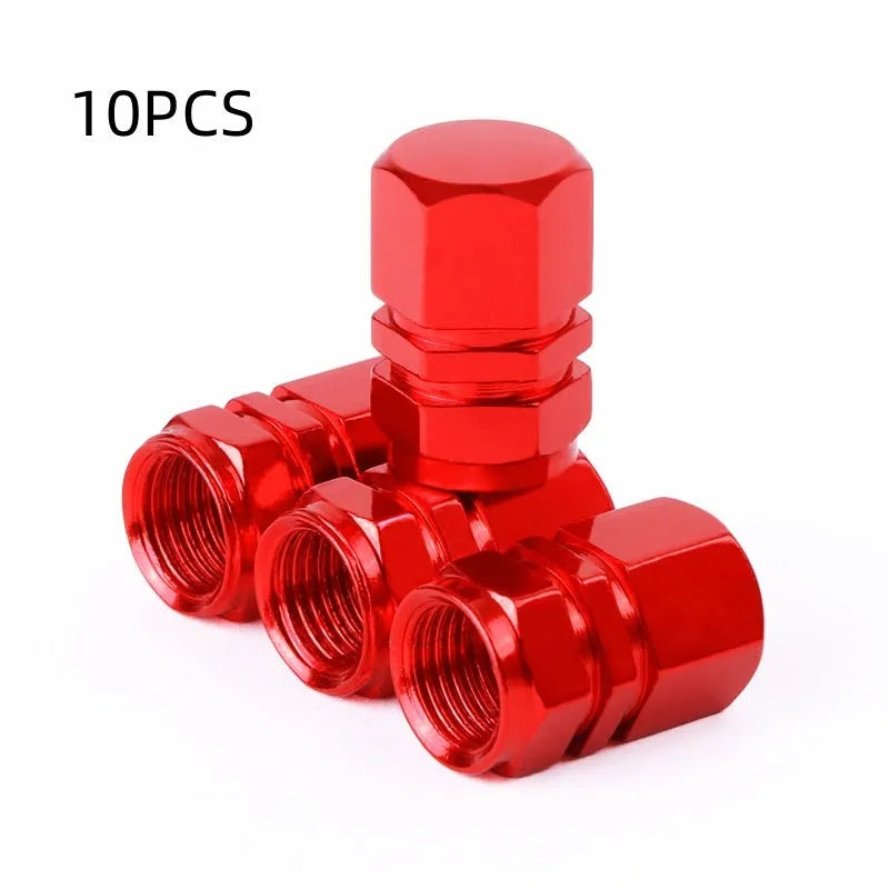 Set of ten aluminium alloy car valve caps in blue, red, silver, gold and black on a white background