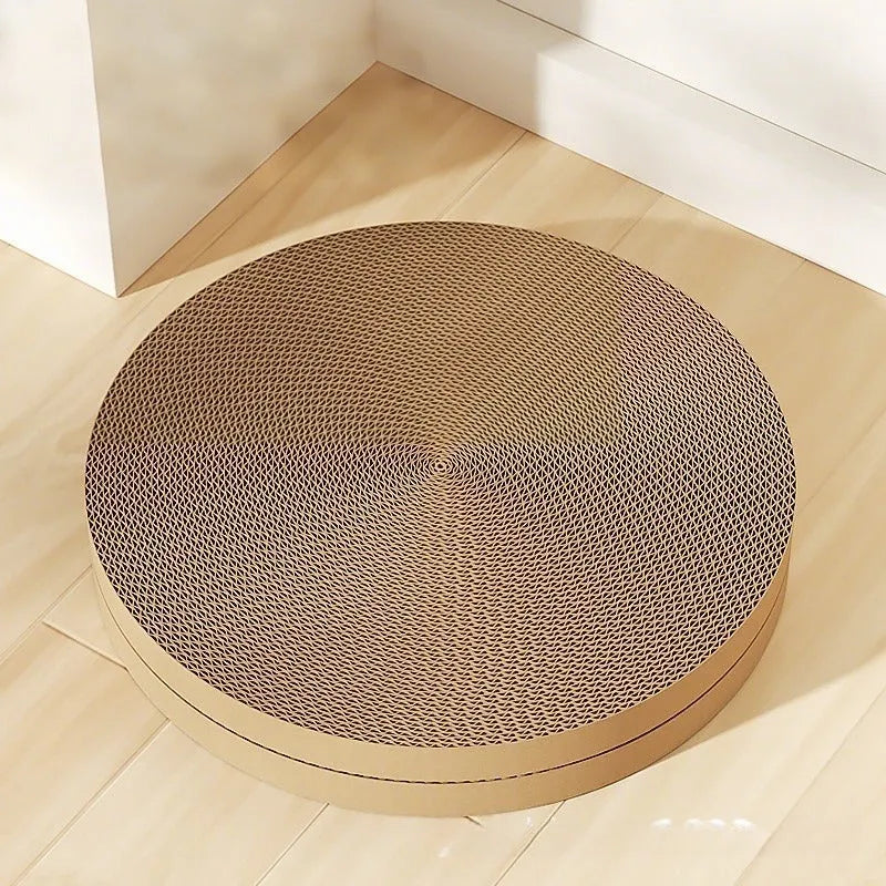 Round green cat scratching board nest with corrugated cardboard surface and two spare refills.