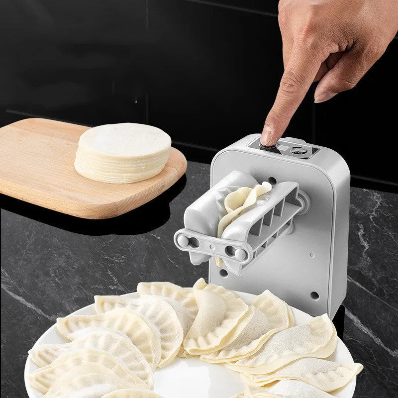 White electric dumpling maker machine with modern design on kitchen countertop