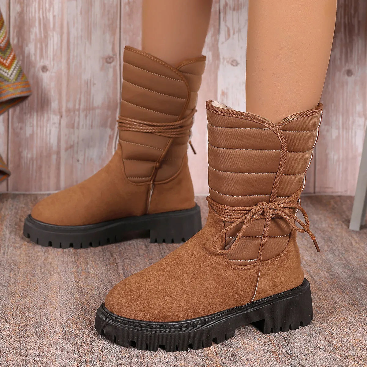 Women's black suede chunky heel snow boots with lace-up design and fleece lining.