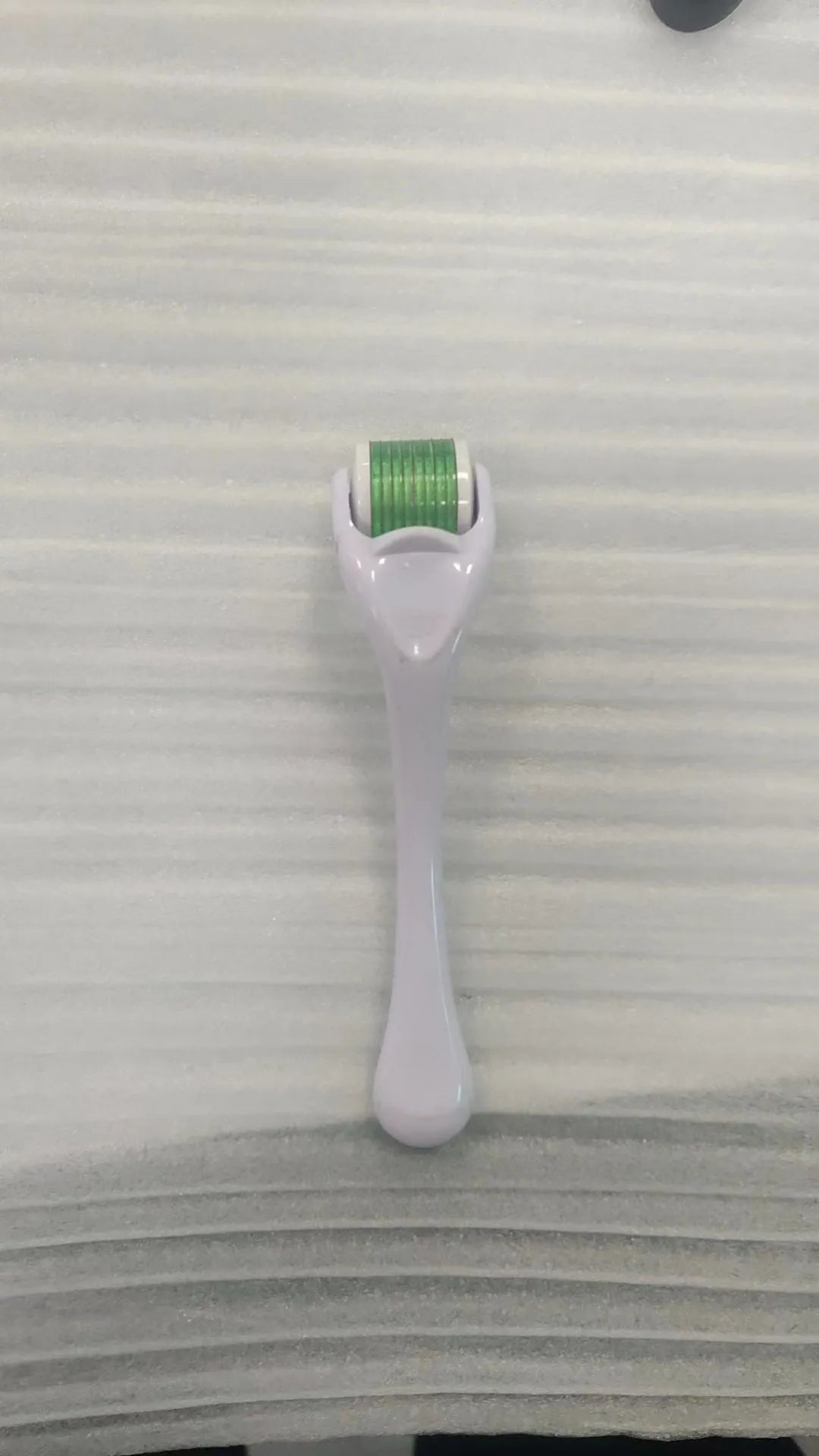 540 micro needle mechanical derma roller with black handle and coloured wheel options