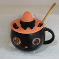 Black ceramic cat-shaped mug with 355ml capacity and optional pumpkin spoon lid